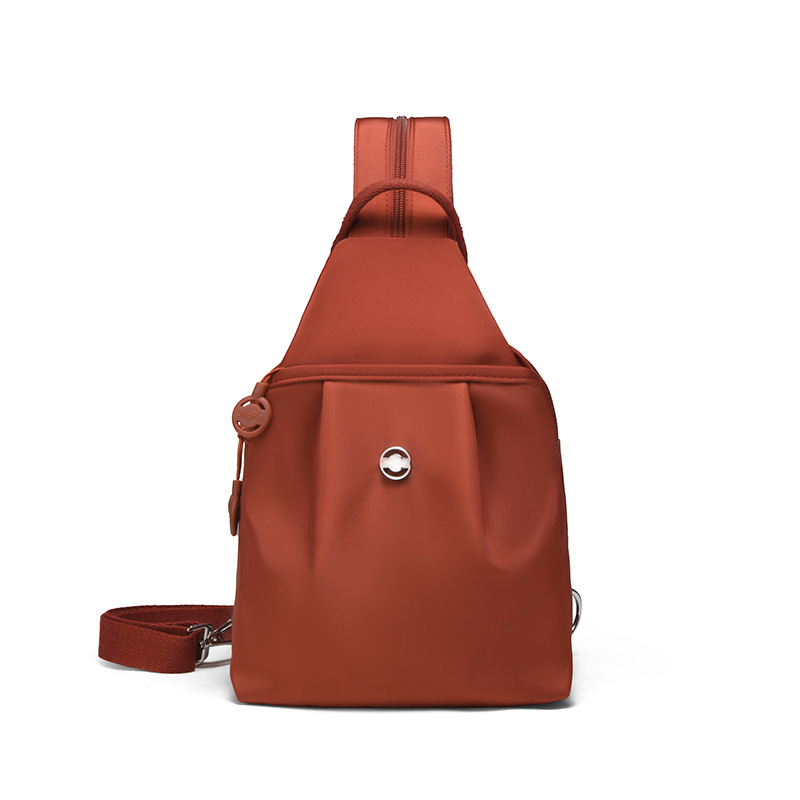 Ruksak i torba s više džepova koji se mogu pretvoriti u ruksak i crossbody