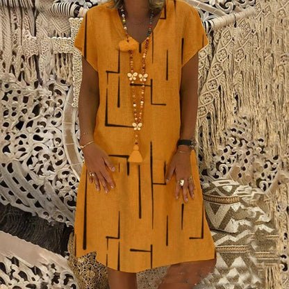 🌲【Kúp jeden, druhý dostaneš zadarmo】👗【S–5XL】Nové šaty s potlačou do V z bavlny a ľanu 🌿Priateľské k pokožke a mäkké